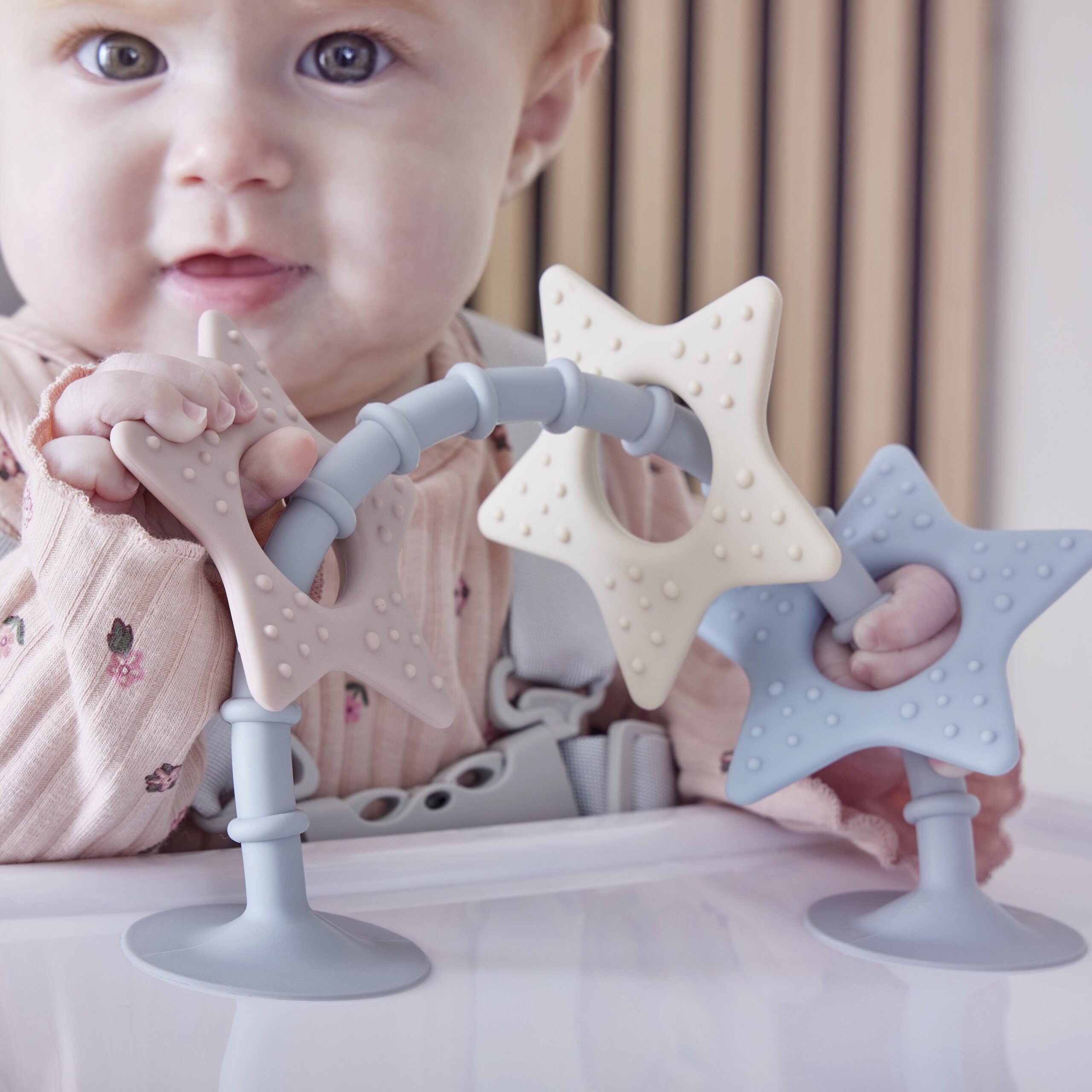 Shnuggle stick n play on highchair with girl close up view square